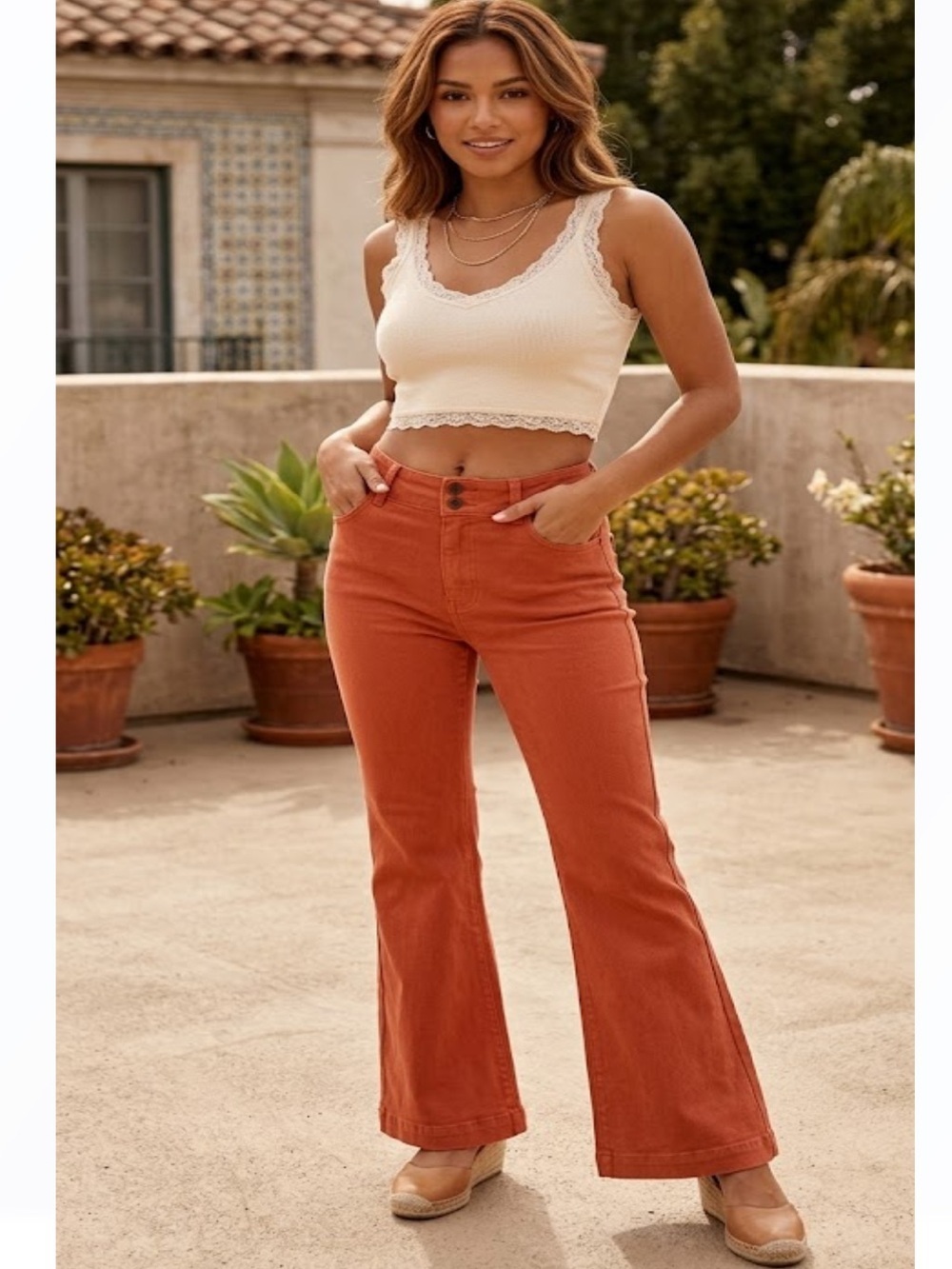 LA MIEL Flared Pants in Rust Orange